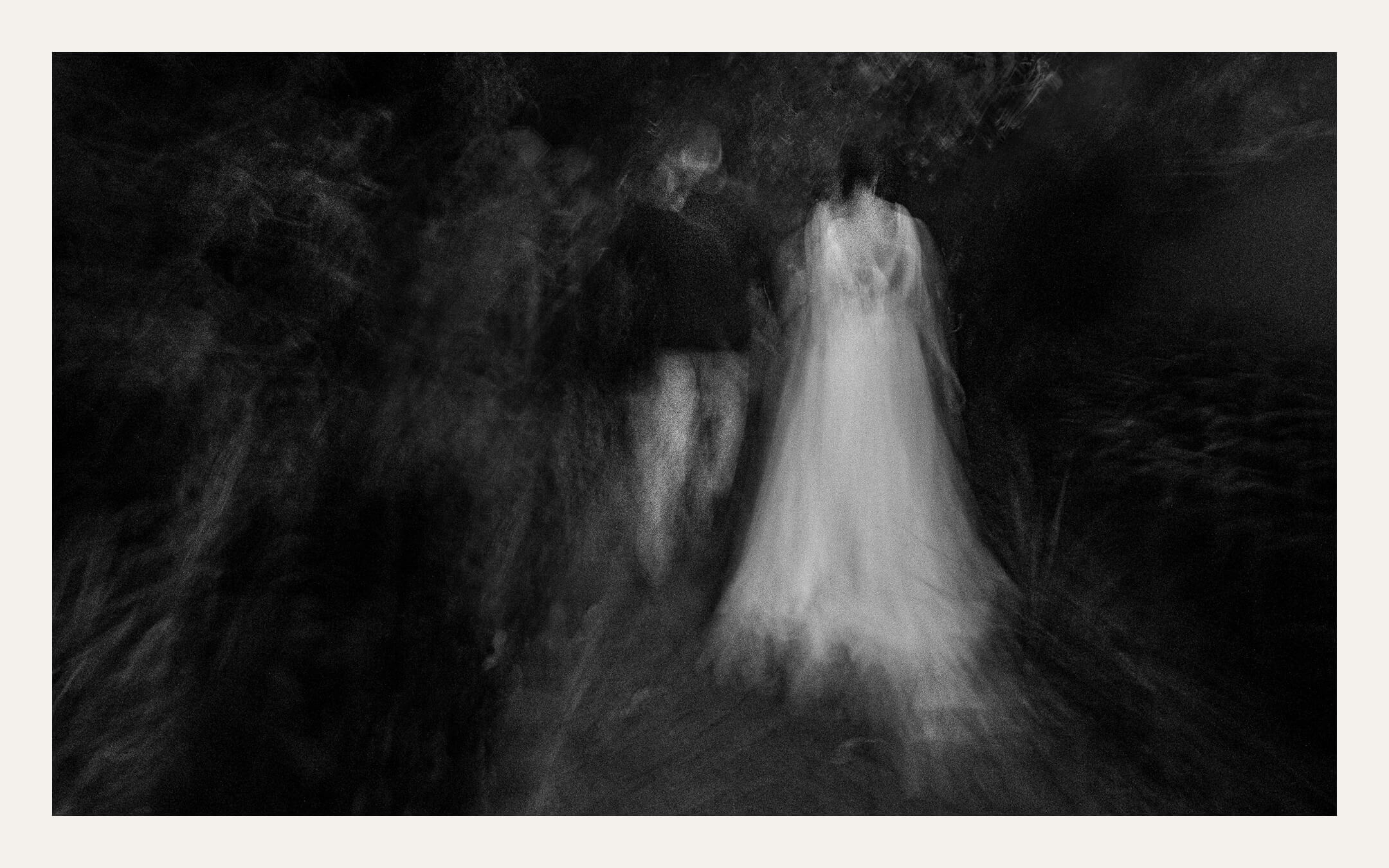 Long exposure of a bride moving through dark trees. Ben Viljoen Photography