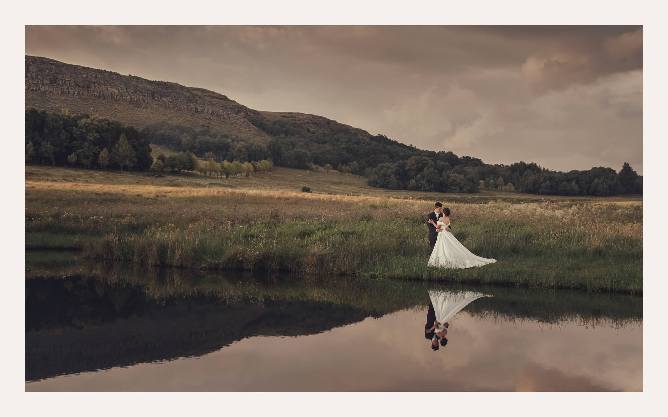 Couple reflected in a still lake — Ben Viljoen Photography